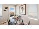 Bright dining area with glass table and view to exterior at 13616 E 103Rd Pl, Commerce City, CO 80022
