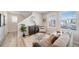 Inviting living room featuring a comfortable sofa, accent chair, and stylish decor at 13616 E 103Rd Pl, Commerce City, CO 80022
