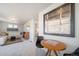 Inviting living area with contemporary decor and access to the bedroom at 13616 E 103Rd Pl, Commerce City, CO 80022