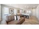 Open-concept living and kitchen area with modern furnishings and appliances at 13616 E 103Rd Pl, Commerce City, CO 80022
