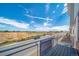 A street view taken from a balcony, showing a construction site under a blue sky at 13616 E 103Rd Pl, Commerce City, CO 80022
