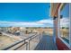 Construction site view from a balcony with silver metal railing at 13616 E 103Rd Pl, Commerce City, CO 80022