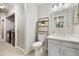 Well-lit bathroom featuring a glass-enclosed shower and sleek vanity with contemporary fixtures and design at 4903 W 73Rd Ave, Westminster, CO 80030