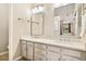 Bathroom with double vanity, framed mirrors, modern lighting, and clean, contemporary design at 4903 W 73Rd Ave, Westminster, CO 80030