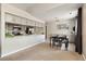 Modern kitchen with stainless steel appliances and a breakfast bar open to the dining area at 4903 W 73Rd Ave, Westminster, CO 80030
