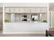 Bright kitchen featuring white cabinets, stainless appliances, and breakfast bar with modern finishes and stylish decor at 4903 W 73Rd Ave, Westminster, CO 80030