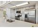 Modern kitchen showcases stainless steel appliances, white subway tile backsplash, and a sleek faucet at 4903 W 73Rd Ave, Westminster, CO 80030