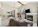 Inviting living room with vaulted ceilings, a cozy fireplace, and an adjacent dining area at 4903 W 73Rd Ave, Westminster, CO 80030