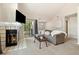 Comfortable living room featuring a fireplace and access to an outdoor balcony at 4903 W 73Rd Ave, Westminster, CO 80030