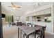 Combined living space with open kitchen, dining area, and comfortable living room with a fireplace at 4903 W 73Rd Ave, Westminster, CO 80030