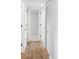 Bright hallway features modern flooring, doors, and plenty of storage space at 1561 W Beekman Pl, Denver, CO 80221