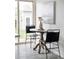 Dining nook features modern chairs and a round table beside a window at 1561 W Beekman Pl, Denver, CO 80221
