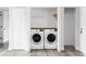 Convenient laundry closet featuring side by side washer and dryer at 1561 W Beekman Pl, Denver, CO 80221