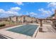 Community pool with a covered pool, lounge area, and well-maintained landscaping create a relaxing outdoor space at 15274 W 64Th Ln # 206, Arvada, CO 80007