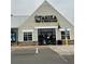 Exterior of Takiza Taco & Tequila Bar with front entrance and parking lot at 15274 W 64Th Ln # 206, Arvada, CO 80007