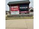 Sign displaying local businesses, including King Soopers, Kohls, Cold Stone, and Takiza at 15274 W 64Th Ln # 206, Arvada, CO 80007