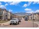 Charming residential street featuring well-maintained townhomes and scenic mountain views in the distance at 15274 W 64Th Ln # 206, Arvada, CO 80007