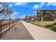 Picturesque walking path, showcasing the homes, a walking path, and a bridge at 15274 W 64Th Ln # 206, Arvada, CO 80007