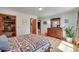 Comfortable bedroom with wood floors, closet, dresser and bright, airy atmosphere at 22349 Natsihi Rd, Indian Hills, CO 80454