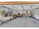 Large, well-lit garage provides lots of room for storage, bikes, and yard equipment with ample parking at 22349 Natsihi Rd, Indian Hills, CO 80454