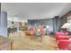 A warm living room with hardwood floors and an inviting space for entertaining, complete with a dining area at 22349 Natsihi Rd, Indian Hills, CO 80454