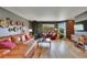 A well-designed living room with an inviting seating area and a seamless connection to the outdoors at 22349 Natsihi Rd, Indian Hills, CO 80454