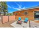 Log cabin exterior with an inviting patio area featuring comfortable seating and a cozy atmosphere at 22349 Natsihi Rd, Indian Hills, CO 80454