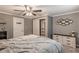 This cozy bedroom has neutral-colored walls and includes a ceiling fan, dresser, and closet at 1151 N Marion St # 104, Denver, CO 80218