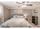Comfortable bedroom with a ceiling fan, neutral walls, and stylish decor at 1151 N Marion St # 104, Denver, CO 80218