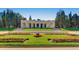 Scenic view of Cheesman Park's grand pavilion with manicured lawns, colorful flowers, and trees at 1151 N Marion St # 104, Denver, CO 80218
