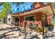 Charming Ks Ice Cream shop exterior with a brick facade, large windows, and outdoor seating at 1151 N Marion St # 104, Denver, CO 80218