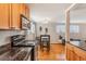 Charming kitchen with stainless steel appliances, granite countertops, and cozy dining area at 1151 N Marion St # 104, Denver, CO 80218