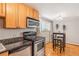 Charming kitchen with stainless steel appliances, granite countertops, and cozy dining area at 1151 N Marion St # 104, Denver, CO 80218