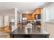 Modern kitchen featuring stainless steel appliances, stylish cabinets, and an adjacent breakfast nook at 1151 N Marion St # 104, Denver, CO 80218