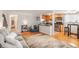 Inviting living room with hardwood floors, modern furnishings, and an open layout to the kitchen at 1151 N Marion St # 104, Denver, CO 80218