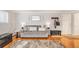 Comfortable living room with a soft sofa, stylish decor, and easy access to the entryway at 1151 N Marion St # 104, Denver, CO 80218