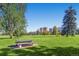 Serene view of Cheesman Park with open green spaces, mature trees, and park benches under a clear sky at 1151 N Marion St # 104, Denver, CO 80218