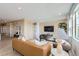 Open concept living room featuring stylish furniture, panelled walls and plenty of natural light at 4110 Grand Lake St, Brighton, CO 80601