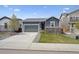 Charming single-story home with a well-maintained lawn and a two-car garage at 95 S Edge Cliff St, Castle Rock, CO 80104