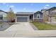 Charming single-story home with a well-maintained lawn and a two-car garage at 95 S Edge Cliff St, Castle Rock, CO 80104
