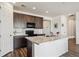 Open kitchen with a large island, stone countertops, and modern appliances at 95 S Edge Cliff St, Castle Rock, CO 80104