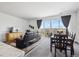 The living room and dining area feature large windows and an adjacent kitchen at 95 S Edge Cliff St, Castle Rock, CO 80104