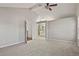 Bedroom with carpet, ceiling fan and view of the en suite bath and closet at 3283 W 102Nd Pl, Westminster, CO 80031