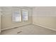 Bedroom with neutral paint, wainscotting, two windows and carpeting at 3283 W 102Nd Pl, Westminster, CO 80031