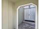 View of the gated front entryway with painted siding and concrete step at 3283 W 102Nd Pl, Westminster, CO 80031