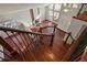 View of the entryway featuring hardwood floors, large windows, a brick fireplace, and decorative iron stair railings at 3283 W 102Nd Pl, Westminster, CO 80031