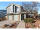 Two-story home with attached two-car garage and brick accents, offering curb appeal at 3283 W 102Nd Pl, Westminster, CO 80031