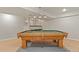 Finished basement game room with pool table, wood flooring and recessed lighting at 3283 W 102Nd Pl, Westminster, CO 80031