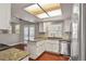 Kitchen area with white cabinets, wooden floors, granite countertops and stainless steel appliances at 3283 W 102Nd Pl, Westminster, CO 80031