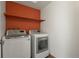 Laundry room with newer side-by-side washer and dryer and built-in shelf at 3283 W 102Nd Pl, Westminster, CO 80031